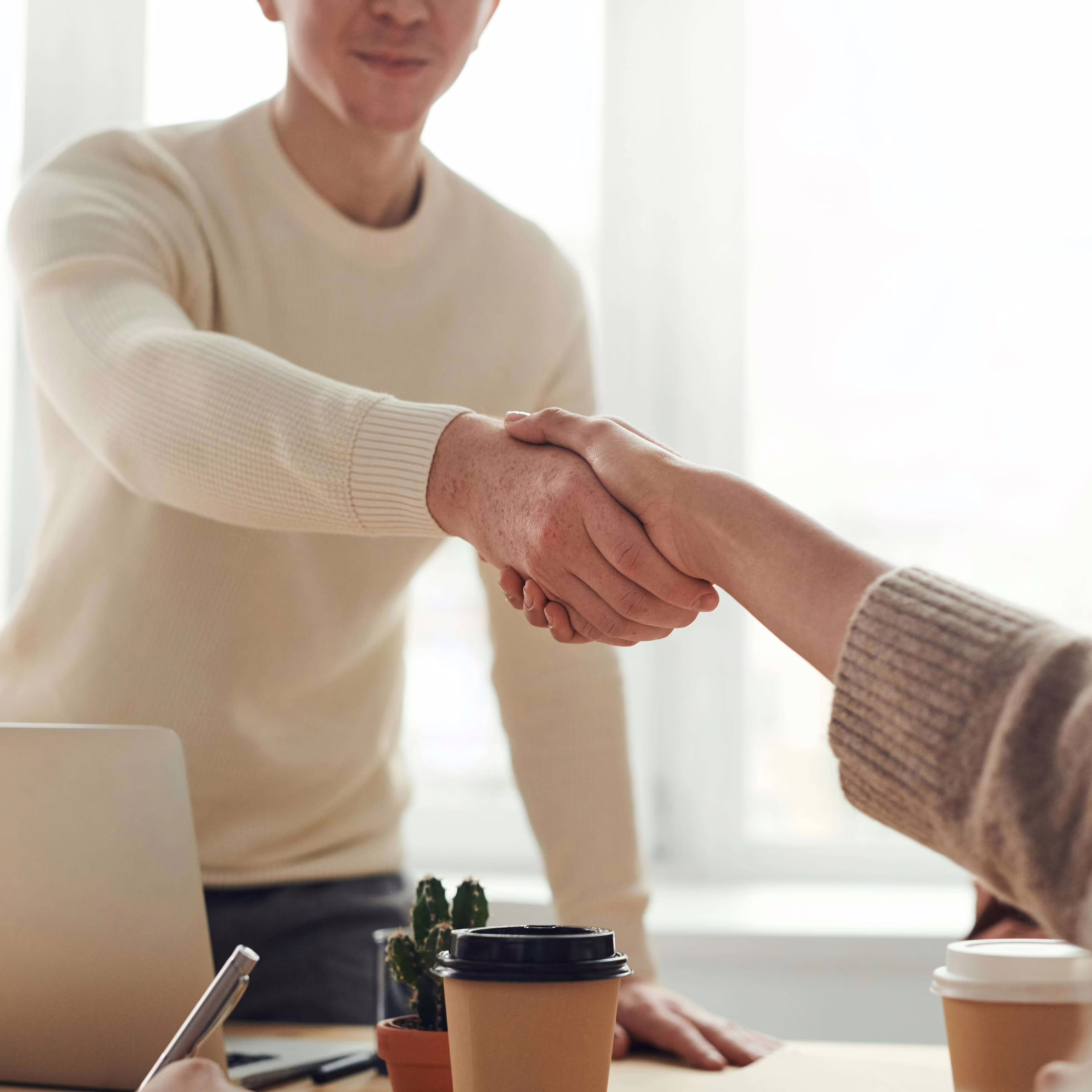 HR business partners shaking hands