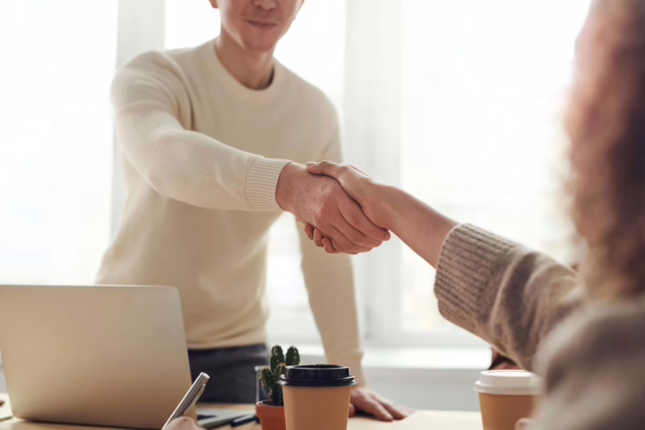 HR business partners shaking hands