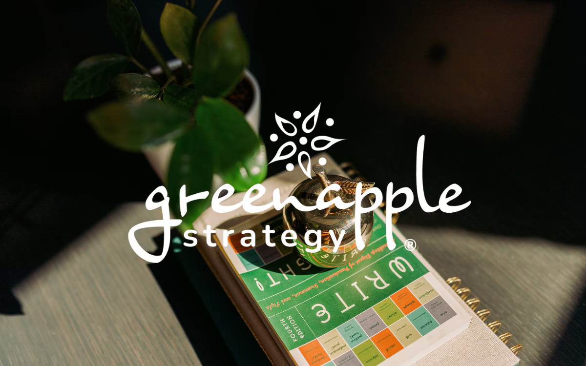 Green Apple Strategy logo over a golden apple