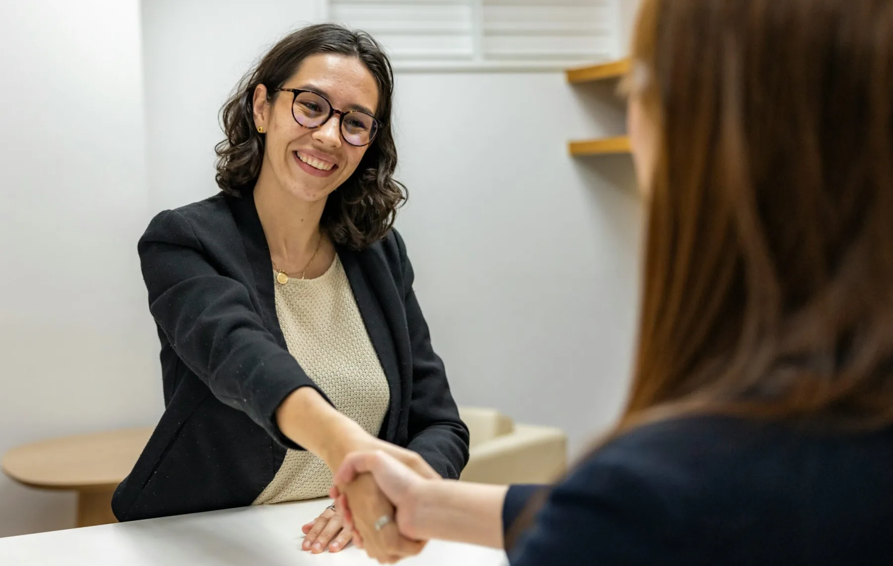 business women shaking hands