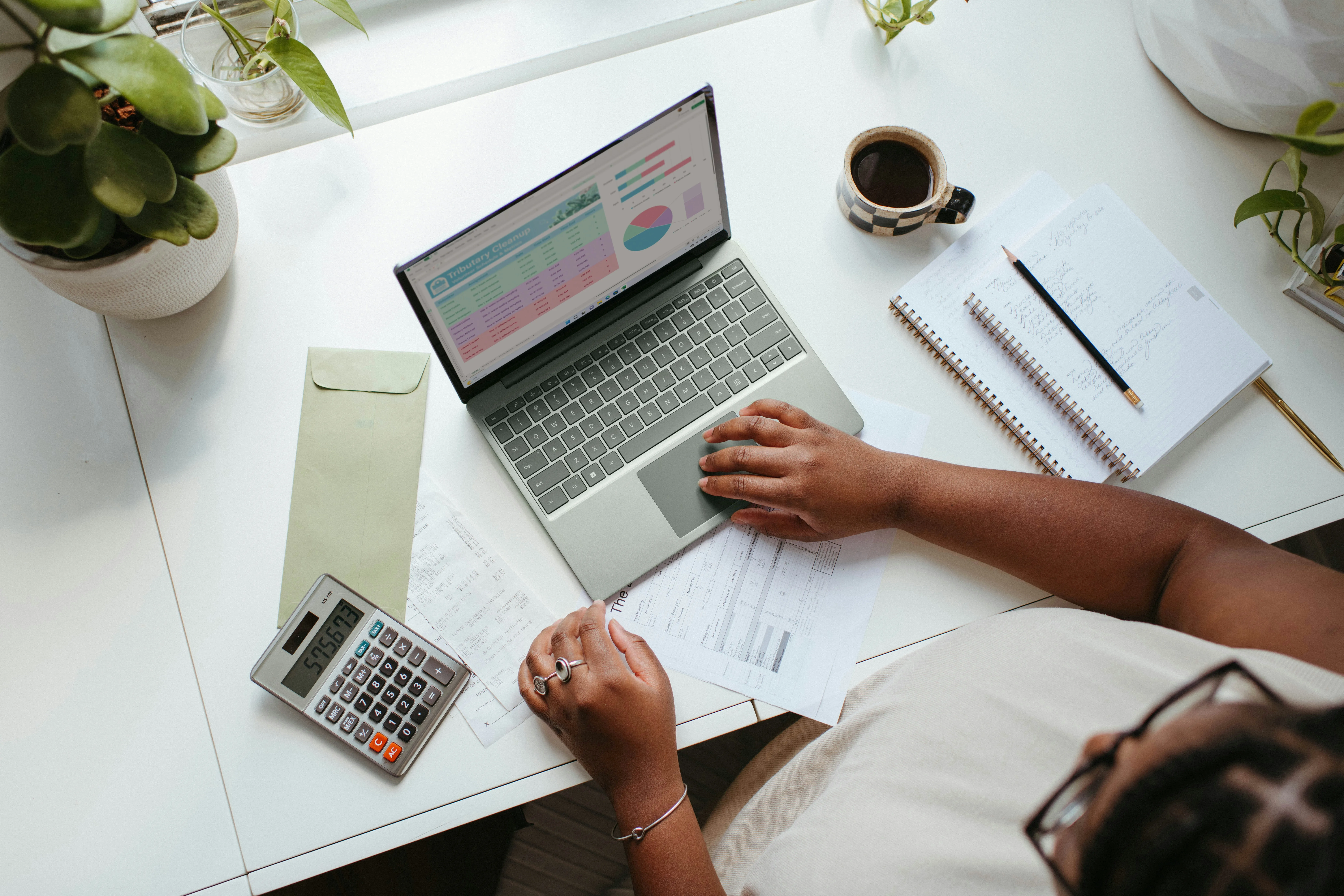 laptop and calculator on desk