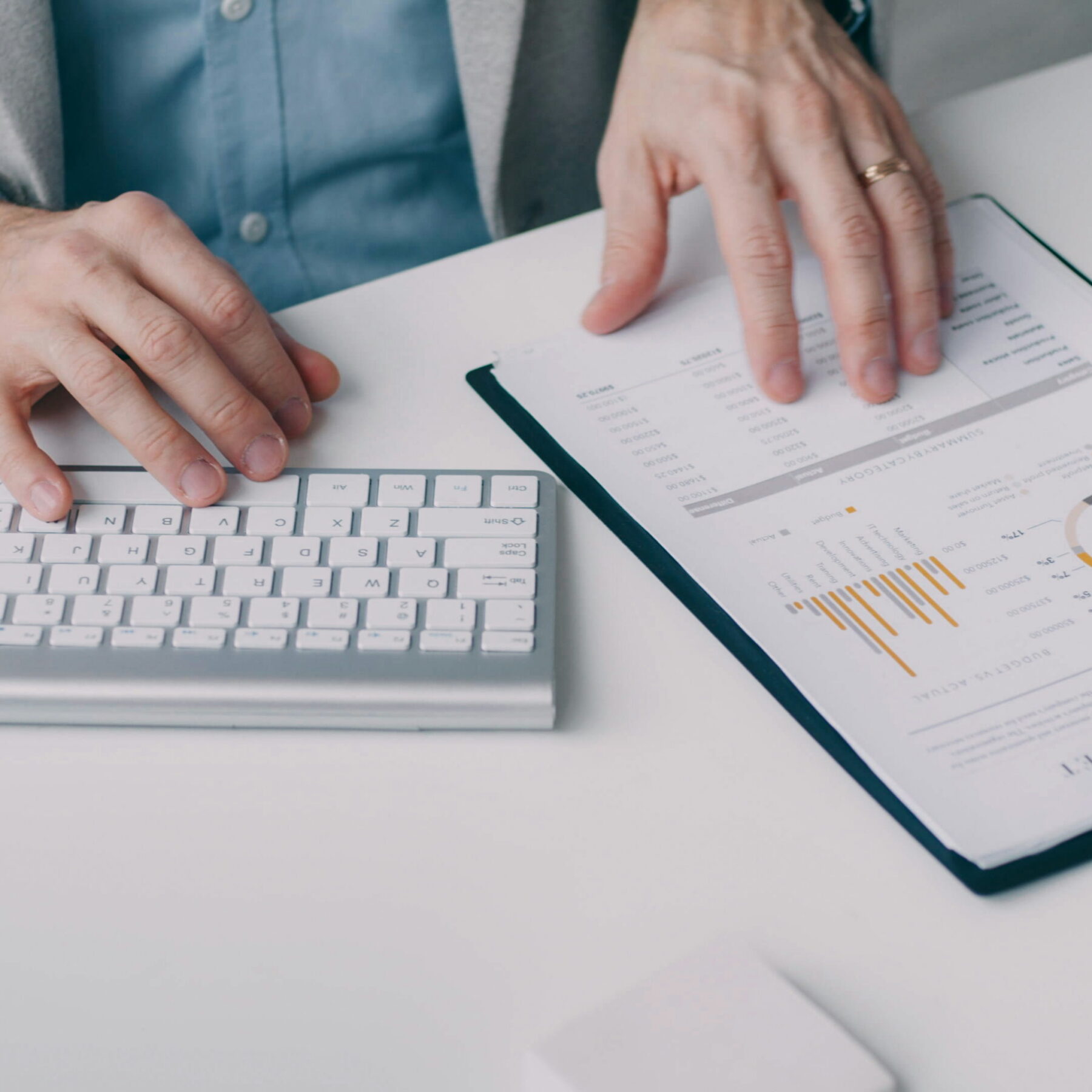 person sitting at desk reviewing data