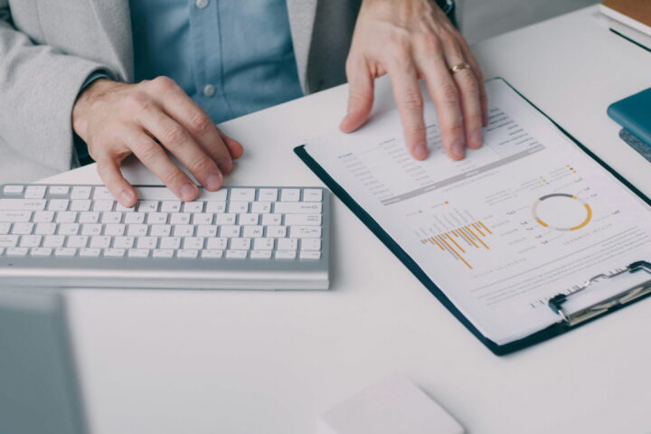 person sitting at desk reviewing data