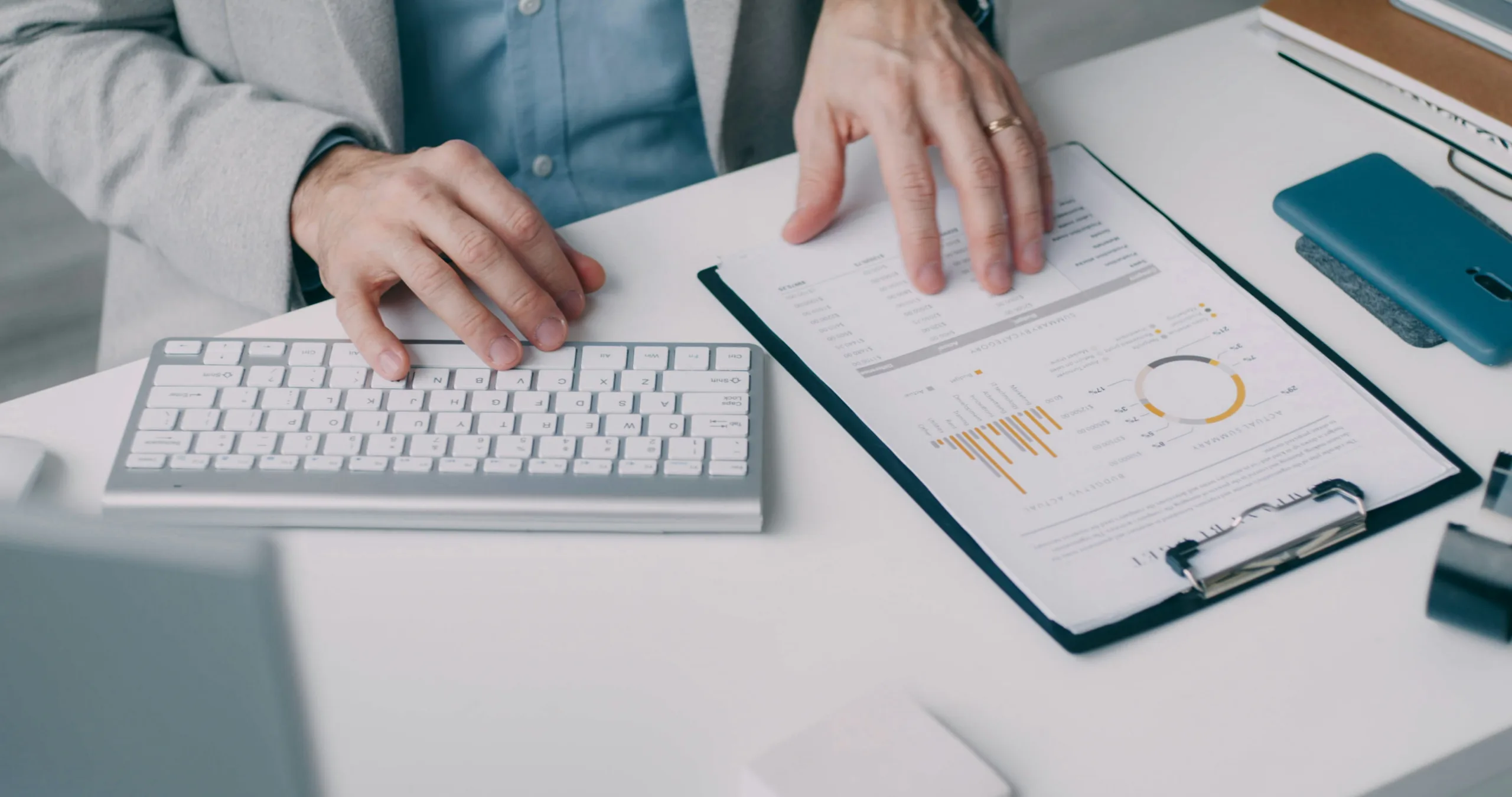 person sitting at desk reviewing data
