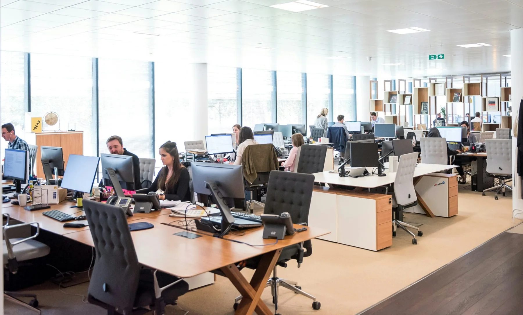 open concept office space with employees working at desks