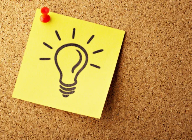 light bulb post it note on corkboard