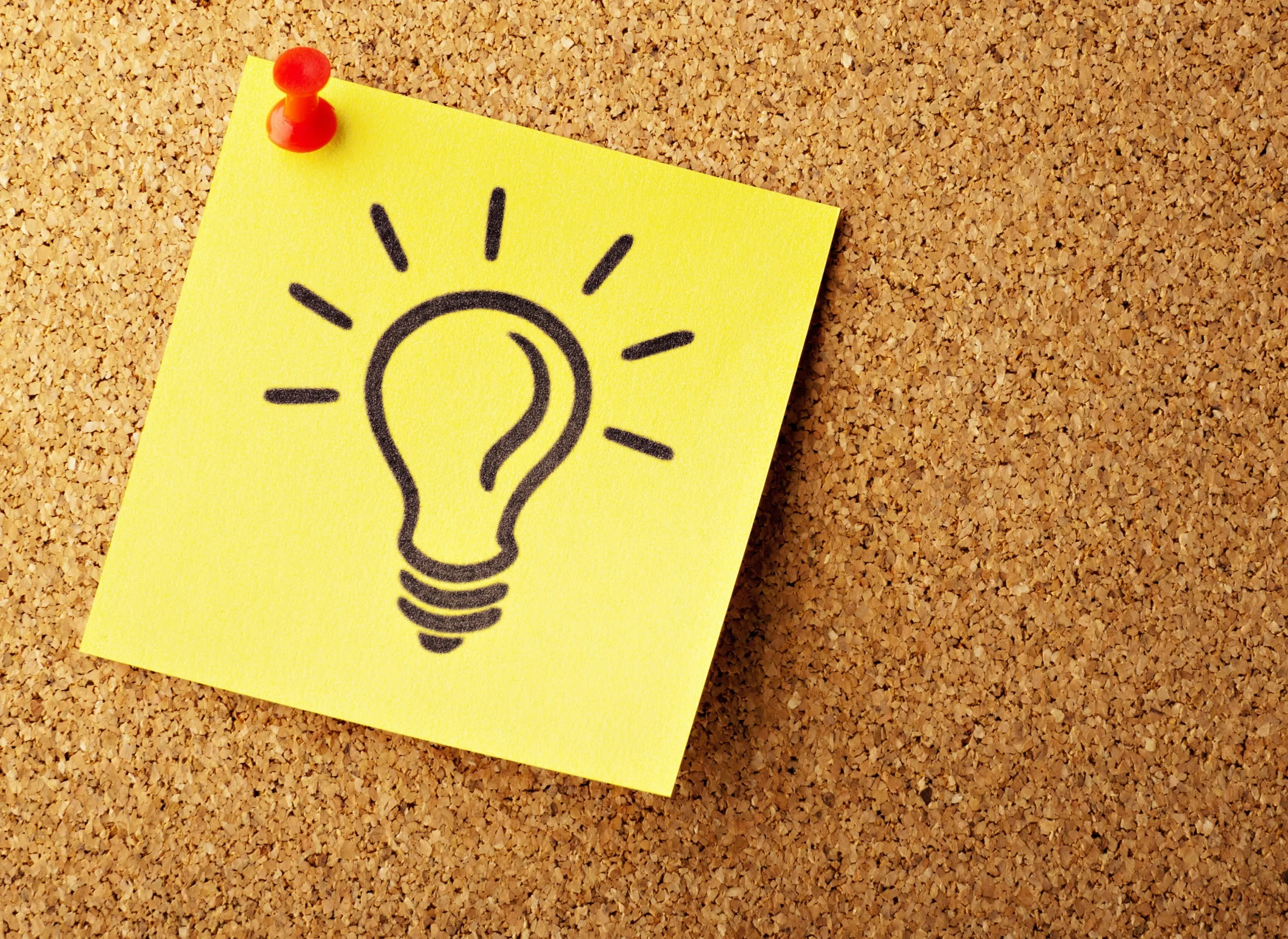 light bulb post it note on corkboard