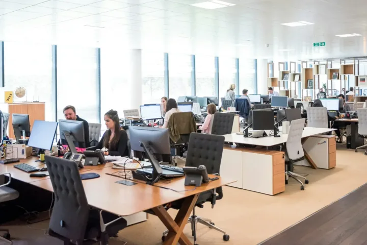 people working in open concept office